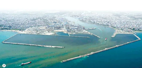 Aerial view of a harbour enclosed by long breakwaters