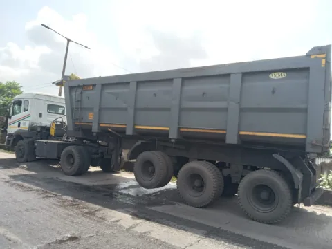 A grey tipper truck at an operational site